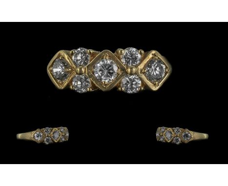 18ct Gold Attractive Diamond Set Ring. Marked 18ct. Excellent Design. The 7 Faceted Diamonds of Good Colour / Clarity. Est Di