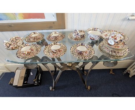 Royal Crown Derby Imari Pattern Set, comprising ten cups, twelve saucers, 12 side plates, two small sugar bowls, a large bowl