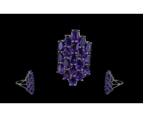 Amethyst Duchess Shape Cluster Ring, nineteen oval cut amethysts, set vertically in rows, form the Duchess shape of the 7.5ct