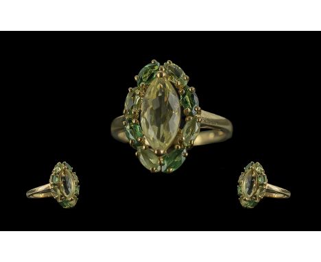 Ladies Attractive 9ct Gold Pale Peridot Set Dress Ring, of pleasing design, full hallmark to shank, excellent colour; ring si