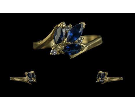 18ct Gold Contemporary Design Sapphire and Diamond Set Ring, full hallmark to interior of shank, the blue faceted sapphires o