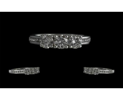 18ct White Gold 3 Stone Diamond Ring with diamond shoulders. Diamonds 1.06 ct. Ring size L.  The three round brilliant cut di