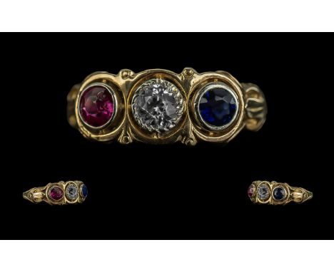 18ct Gold Impressive Three Stone Sapphire Set Ring, the centre white sapphire with blue and red sapphires to sides of excelle