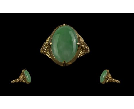 Chinese Pleasing Quality 22ct Gold Jade Set Ring.  Chinese gold character marks to interior of mount.  The oval shaped Jade s