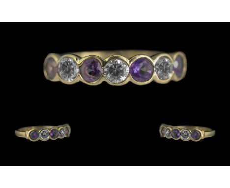 Ladies 9ct Gold Attractive Amethyst & CZ Set Dress Ring. Full Hallmark to Shank. Amethysts of Pleasing Colour. Ring Size O. W