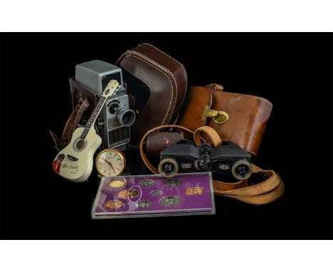 Assorted Collectibles including a G.B. Bell & Howell Camera in a leather case with accessories, a pair of Carl Zeiss Binocula