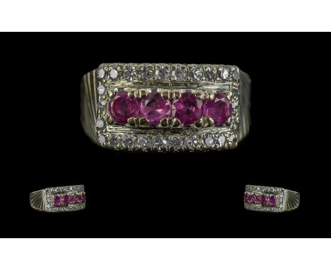 A 14 Carat Gold Diamond And Ruby Ring four round brilliant cut rubies approx 4.5mm in diameter surrounded by a channel of 26 