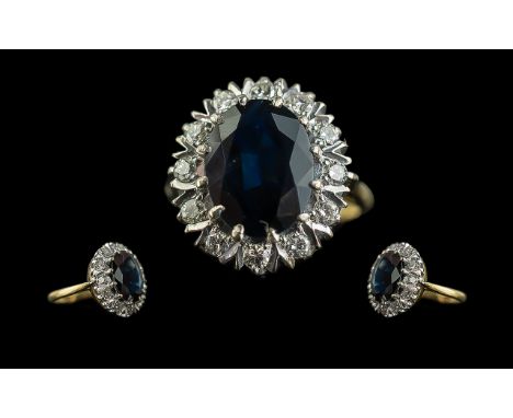 Ladies 18ct Gold Attractive Sapphire and Diamond Set Cluster Ring. Marked 18ct to Interior of Shank. The Central Large Facete