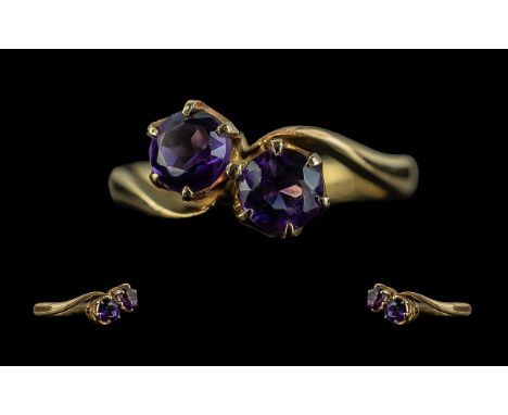 Ladies 18ct Gold Attractive Two Stone Amethyst Set Ring, full hallmark for 18ct to shank.  The faceted Amethysts of deep purp