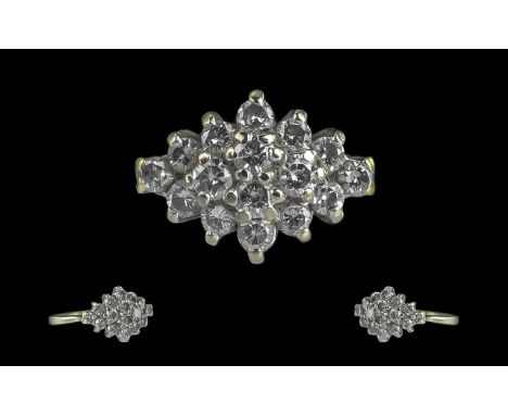Ladies Attractive 18ct Diamond Set Cluster Ring, marked 750 to shank, hallmarked Birmingham 1988, the round brilliant cut dia