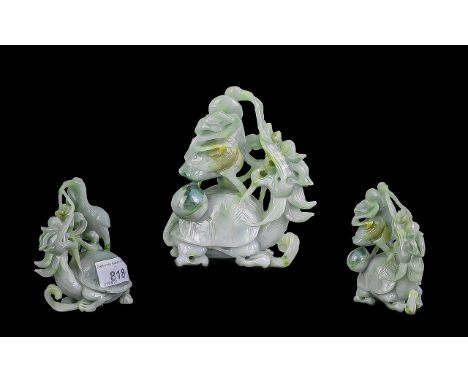 A 20th Century Oriental Carved Jade Sculpture depicting a stylised dragon. Height 4 inches.  