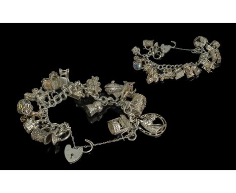 A Vintage Sterling Silver Charm Bracelet - Loaded with 16 Sterling Silver Charms. All Marked for Silver. Comprises Horse and 