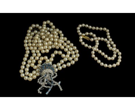Single Strand of Pearls, with 9ct clasp, together with a Trifari triple strand pearl necklace with a blue and white crystal p