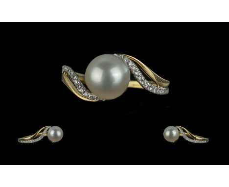 18ct Yellow Gold Cultured Pearl and Diamond Twist Ring. Diamonds 0.15ct.  Ring size M.  Large central pearl with twist should