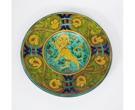 A large Della Robbia wall charger  by Gwendoline Buckler, incised to the well with a lion rampant, with thistle, rose and sha