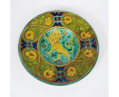 A large Della Robbia wall charger  by Gwendoline Buckler, incised to the well with a lion rampant, with thistle, rose and sha