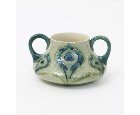 'Peacock Feathers' a Moorcroft Pottery sugar basin designed by William Moorcroft, twin-handled form, painted with Art Nouveau