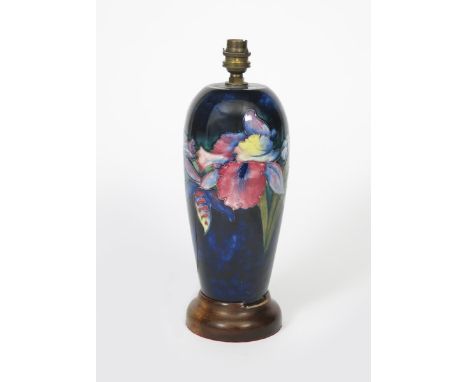 'Frilled Orchid' a Moorcroft Pottery lamp base designed by William Moorcroft,  painted in colours on a blue ground, on wooden