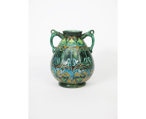 A Della Robbia Pottery Cantagalli twin-handled vase by Gertrude Russell,  swollen form with applied Dolphin handles to the sh