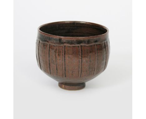 ‡ David Leach OBE (1911-2005) a Lowerdown cut-sided bowl, covered to the foot with a tenmoku glaze impressed seal mark to bas