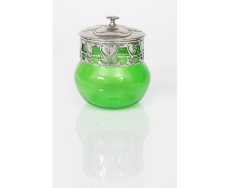 A Liberty &amp; Co Tudric Pewter  biscuit barrel designed by Archibald Knox, with later green glass liner, cast in low relief