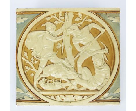 A large architectural Boar Hunt tile possibly by Minton, modelled in low relief with a medieval figure felled and fighting a 
