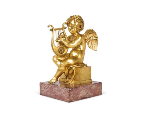 A GILT BRONZE FIGURE OF A WINGED CHERUB FRENCH, 19TH CENTURY     Of seated form playing a lyre, variegated pink marble base  