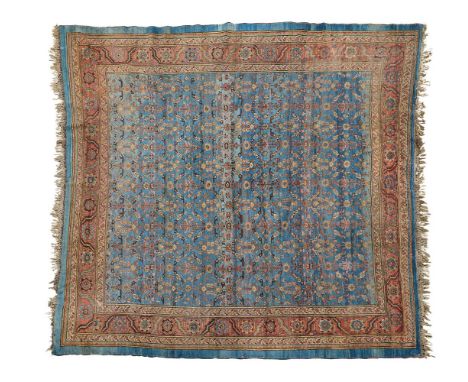 A LARGE BLUE GROUND CARPET, POSSIBLY A TURKISH USHAK Approximately 350 x 320cm Saleroom Notice: Please note, this carpet appe