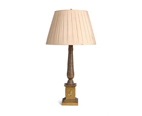 A GILT METAL TABLE LAMP IN THE EMPIRE STYLE  FRENCH, MID/LATE 19TH CENTURY AND LATER  Fitted for electricity with twin light 