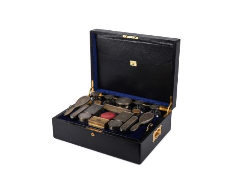 Y&nbspA LEATHER CASED TRAVELLING SILVER AND SILVER MOUNTED TOILET SET MAKER'S MARK N.M, LONDON 1914 The leather case opening 