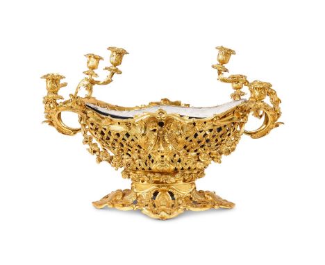 A FRENCH GILT BRONZE TABLE CENTREPIECE  EARLY 20TH CENTURY  Tole liner, fruit and flower moulded form with six candle branche