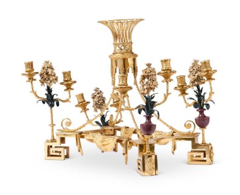 A GILT BRONZE AND PORPHYRY MOUNTED TABLE CENTREPIECE  ITALIAN, 19TH CENTURY  With central basket on open scrolling frame, par