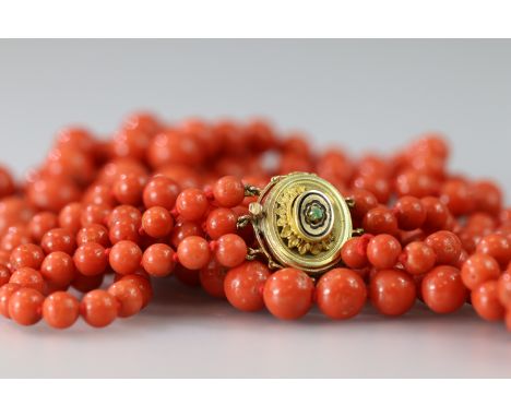 festooned to the front with beads ranging from 5.7mm.to 13.5mm., with an antique gold and enamel clasp  159gm.total weight (a