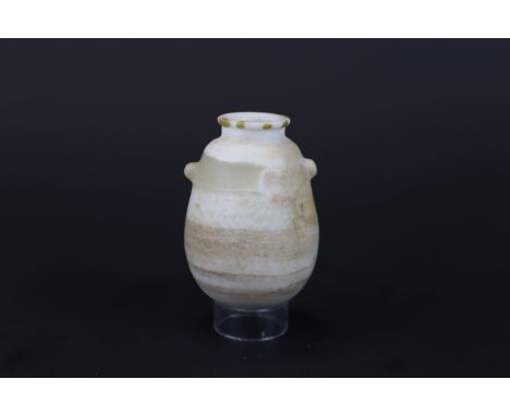 A Small Egyptian Alabaster Jar, New Kingdom, circa 1553-1085 B.C.  H:7cm  Restoration of chips at rim and minor retouched at 