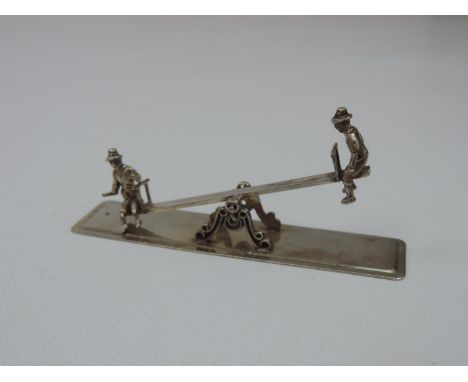 A Dutch Miniature Silver Seesaw, with Two Children Playing, One Sitting Side-Saddle and the Seesaw Moves on its Pivot - Hallm