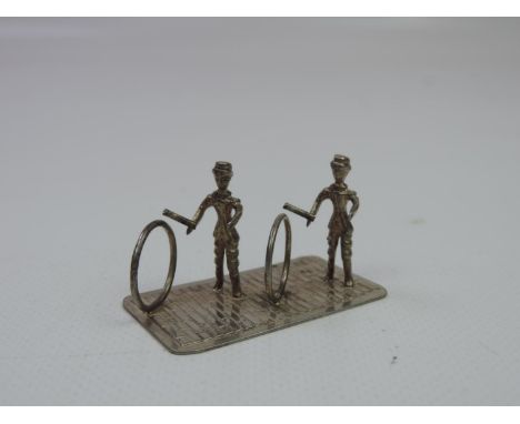 A Dutch Miniature Silver Figure of Two Children Playing with Hoops - Hallmarked with the Dutch Sword Mark and Makers Mark is 