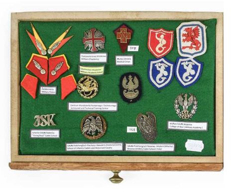 A Second World War Display of Polish Badges and Insignia, including a Military Chaplaincy white metal and enamel breast badge
