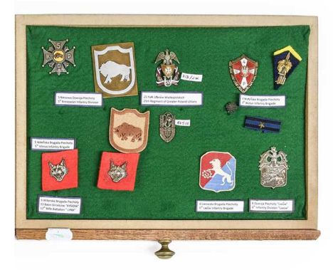 A Display of Second World War Polish Badges and Insignia, including two 13th Vilnius Rifle Battalion "Lynx" badges, a 5th Kre