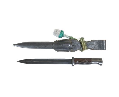 A Second World War German K98 Mauser Bayonet, the blackened steel fullered blade stamped 6643/0 to one side of the ricasso, t