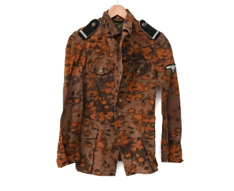 A Second World War German Waffen-SS Autumn Camouflage Tunic, with four patch pockets with buttoned flaps, the left arm set wi