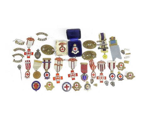 A Collection of Twenty Various British Red Cross Society Badges, mainly to the Rhodes family, including service badges, profi