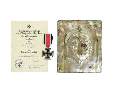 A German 1939 Iron Cross, Second Class, no visible marks, with a citation to Gefreiten Heinrich Kafka, 2./Art.Regt.71, dated 