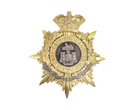 A Victorian Helmet Plate to an Officer of the Essex Regiment, in gilt brass with QV crown over a black velvet backed silver S