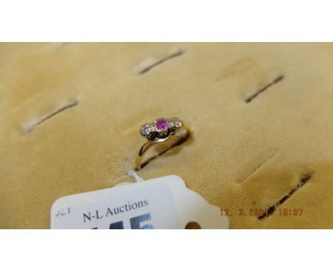 A hallmarked 18ct gold, Ruby and Diamond cross over ring