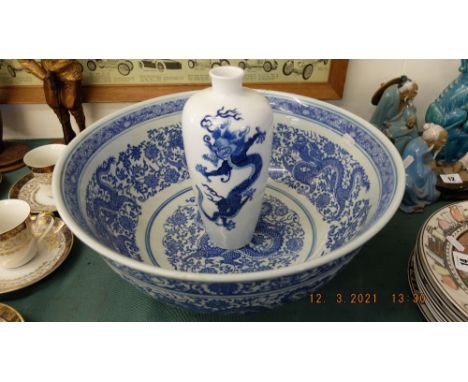 A large blue and white bowl, Chinese vase and two plates