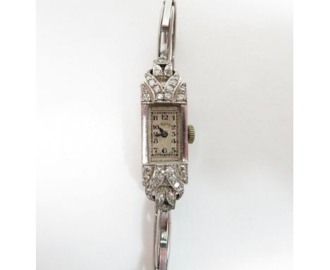 Asprey, a ladies diamond set cocktail watch, the rectangular signed dial with black Roman numerals and hands, set with single