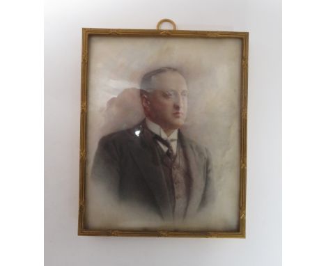  An early 20th century/late 19th century half portrait of a gentlemen, dressed in black in a gilded frame, 13cm x 11cm 