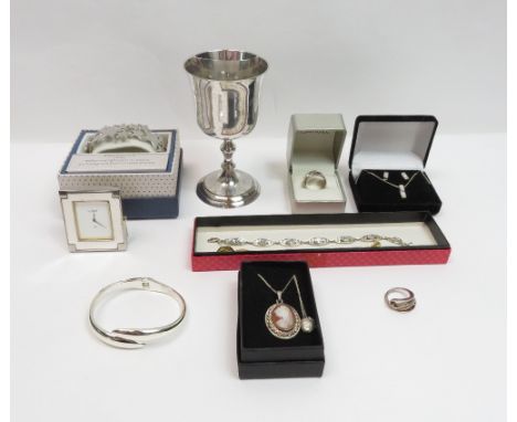 A small collection of jewellery, some stamped '925'; with a Links of London travelling clock; and a plated goblet