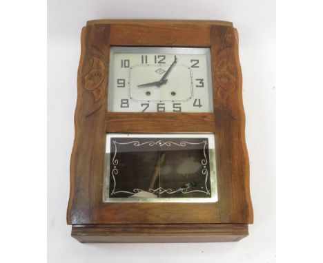 A French oak wall clock with silver FBL face