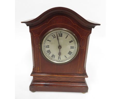 A mahogany cased mantel clock with a silvered dial